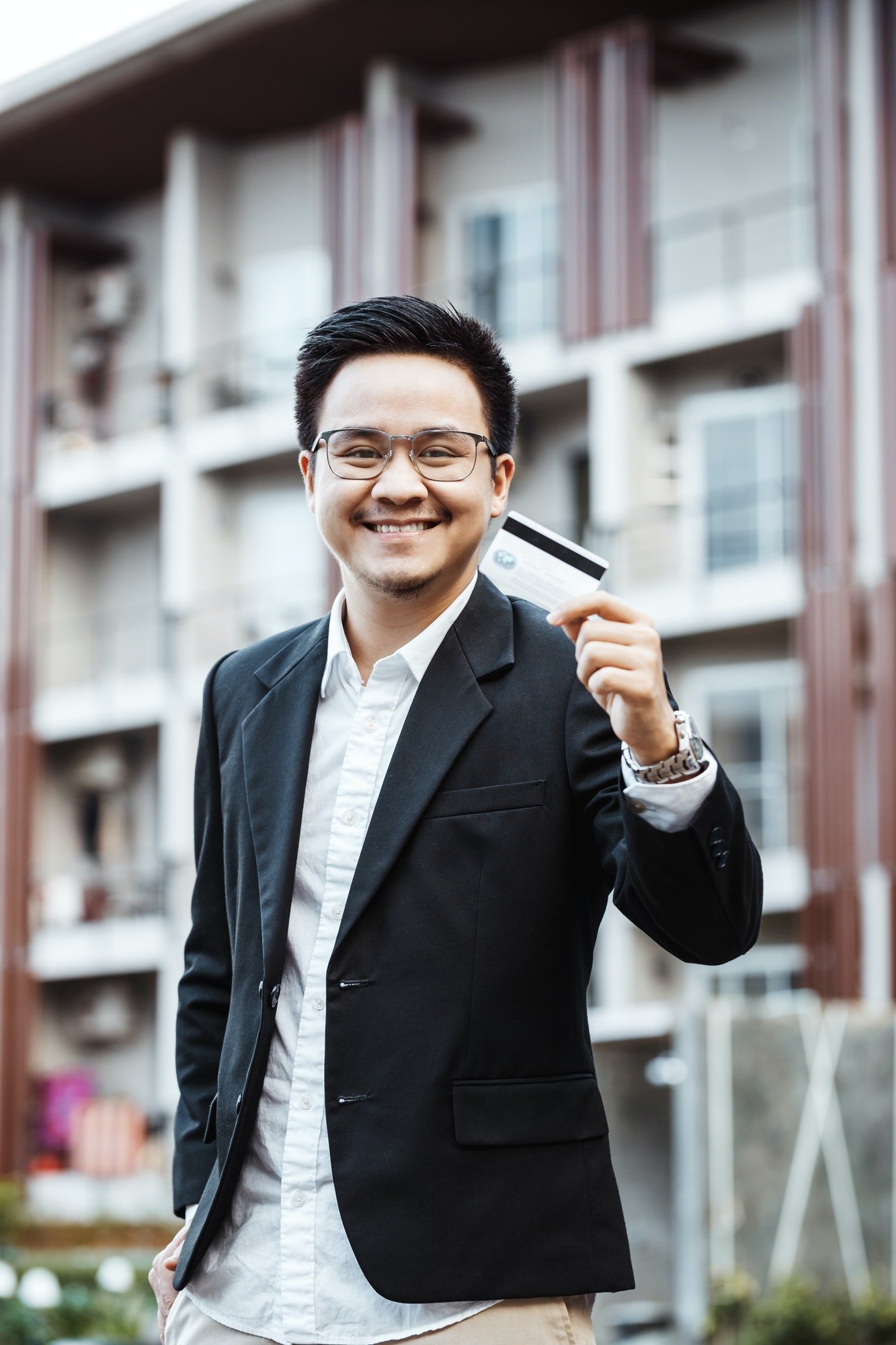 young-handsome-man-enjoy-shopping-online-on-mobile-phone-with-credit-card.jpg